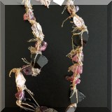 J098. 14K gold necklace with colored and black stones and loose hanging chains. - $175
